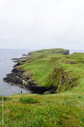 Amazing green and rocky landscape of the tiny island of Staffa. It is a wild and preserved natural place in the inner hebrides of Scotland. The view of the ocean from here is very ispiring 