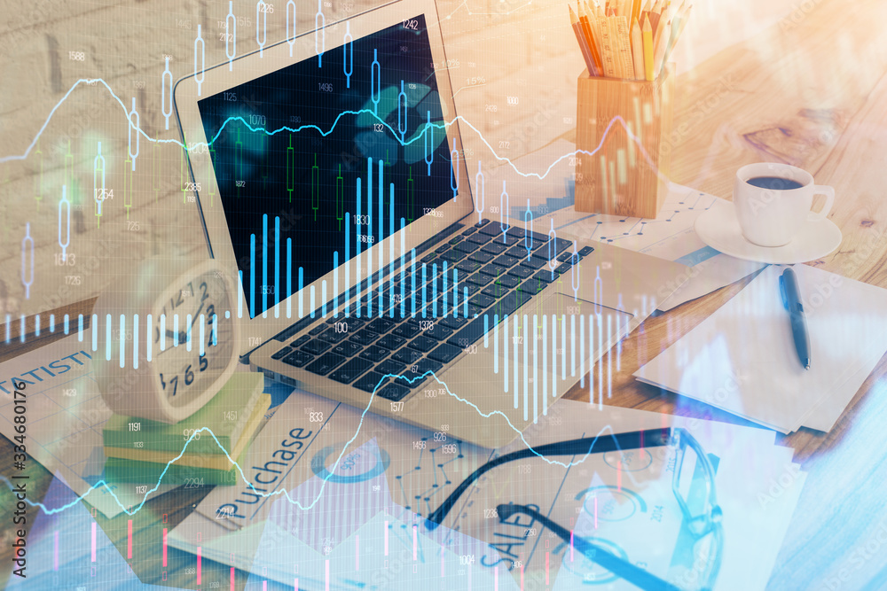 Financial graph colorful drawing and table with computer on background. Double exposure. Concept of international markets. Financial graph colorful drawing and table with computer on background. Double exposure. Concept of international markets.