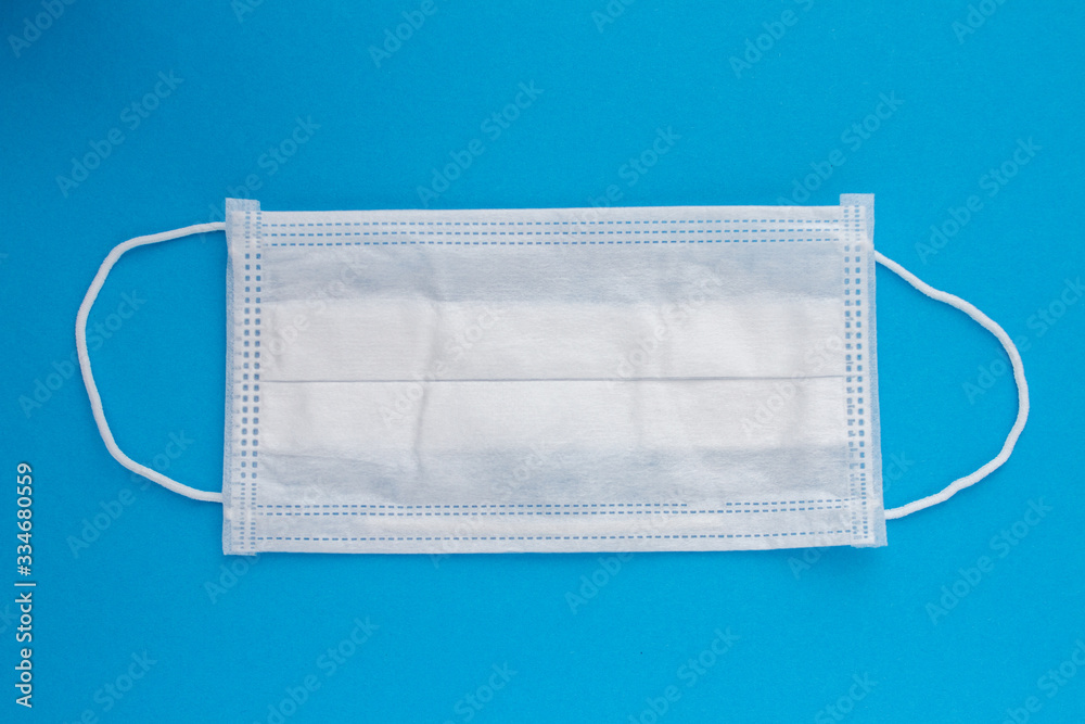 surgical medica whitel mask on a blue background surgical medica whitel mask on a blue background
