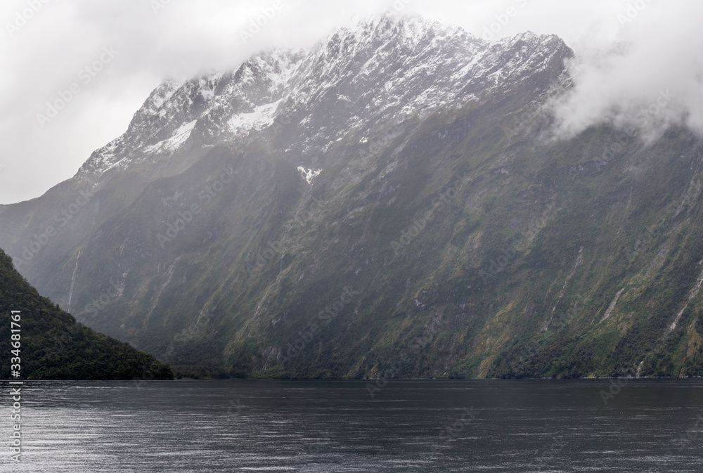 steep rocky slopes at fjord shores,  Milford Sound, New Zealand