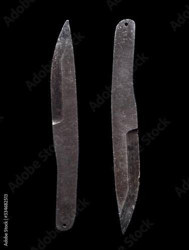 A pair of scratched steel throwing knives on black background (ID: 334682513)