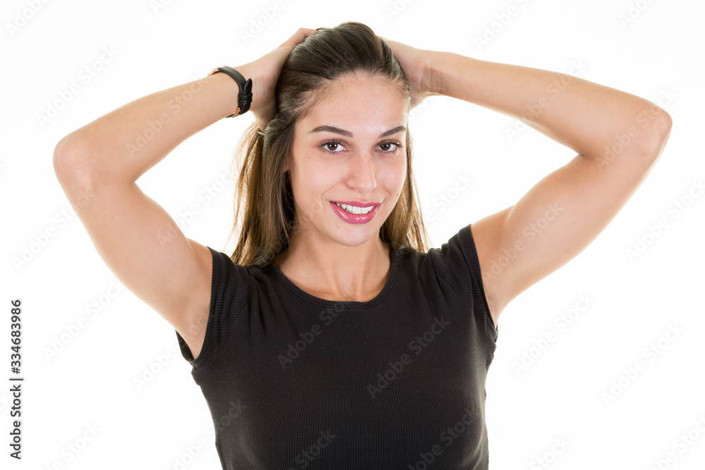 Portrait of cheerful girl laughing pretty young woman brunette happiness and beauty hands on hairs isolated on white background