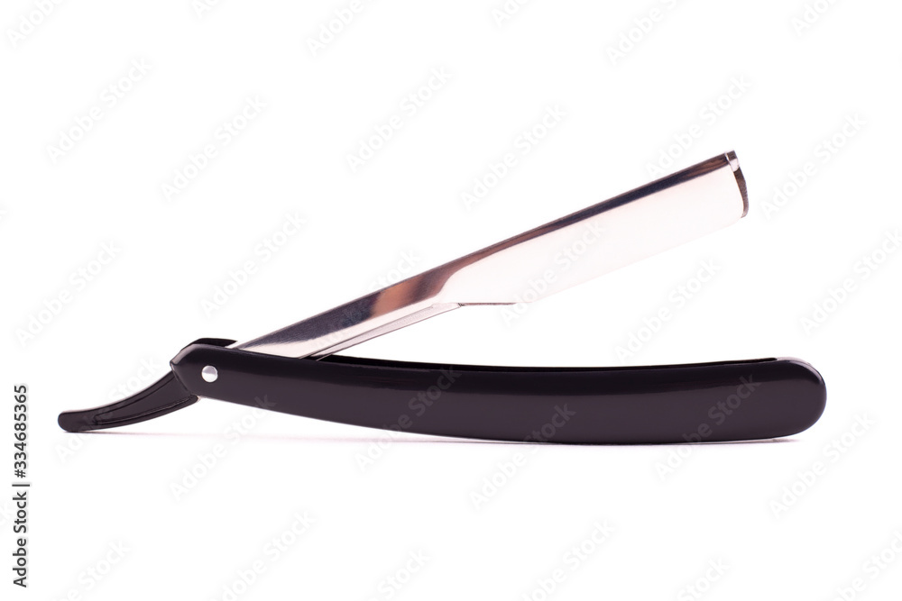 A classically styled straight razor on white A classically styled straight razor on white