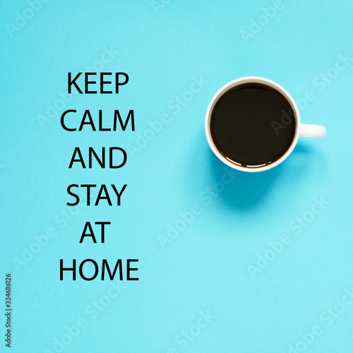 Keep calm and stay at home. Self isolation and quarantine campaign to protect yourself and save lives. Flat lay cup of black coffee. - Image