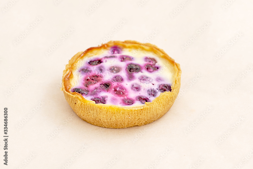 Cake basket with cherry jam. Range of bakery and bread products. Closeup on a light background Cake basket with cherry jam. Range of bakery and bread products. Closeup on a light background