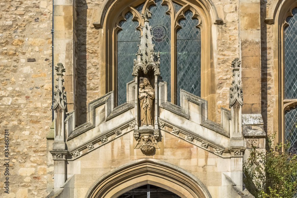 Detail view at the ornamented statue on the exterior facade at the Great St Mary's Church