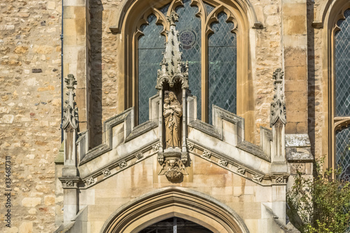 Detail view at the ornamented statue on the exterior facade at the Great St Mary s Church