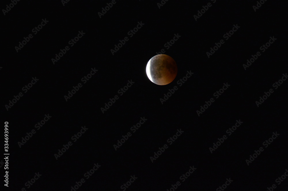 A red moon eclipse on a dark sky A red moon eclipse on a dark sky