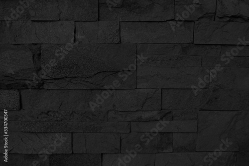 Abstract black stone wall texture.