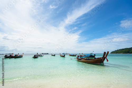 Longtail boats and sea. Pattaya Beach, Koh Lipe, Thailand. © upslim