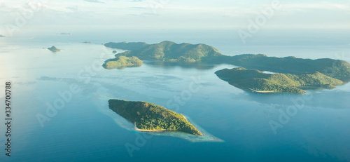 Aerial view over beautiful Philippine islands and deserted beaches.