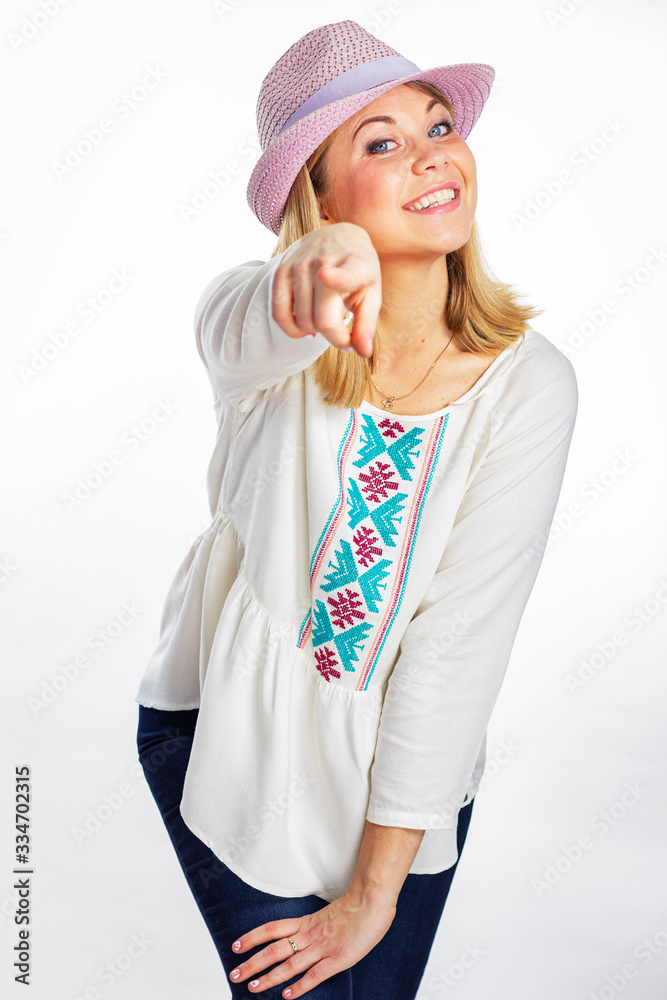 An isolated portrait of a girl shows with index finger. Portrait of a smiling woman in a hat. An isolated portrait of a girl shows with index finger. Portrait of a smiling woman in a hat.