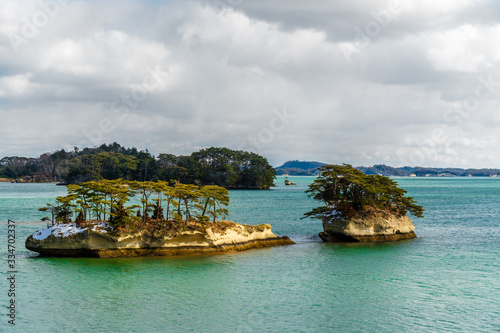 Islands in Matsushima Bay on a sunny evening with cloudy sky. Close to Sendai in Japan.