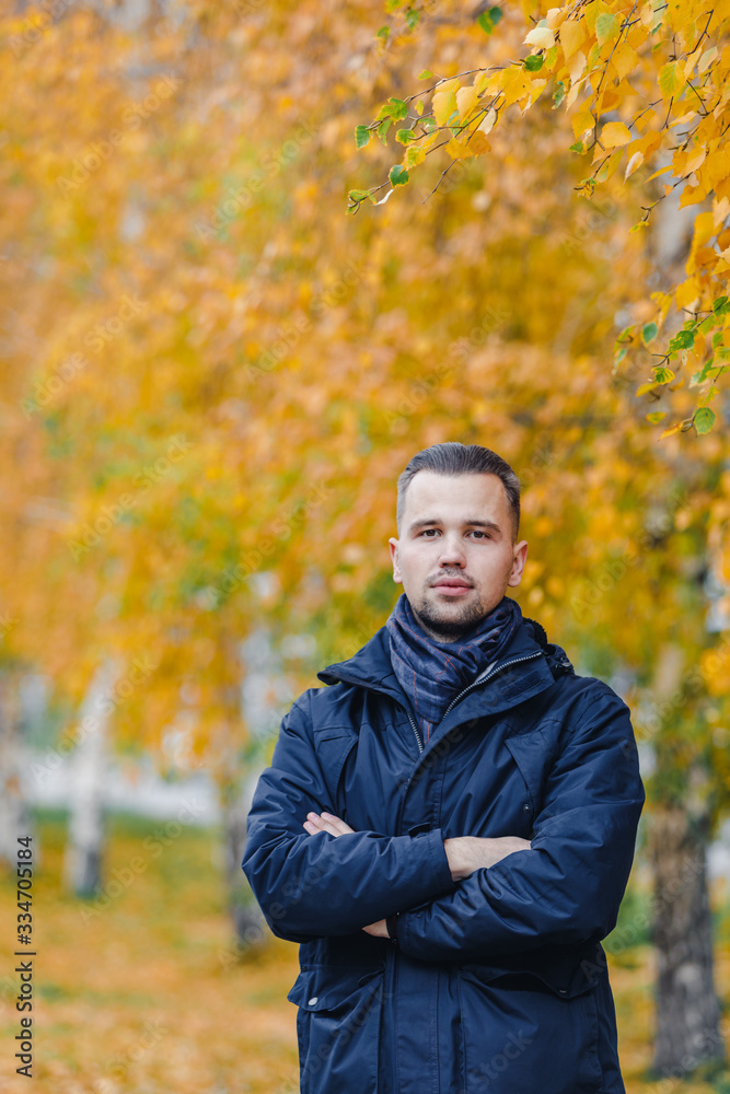 Young man in the autumn park Young man in the autumn park