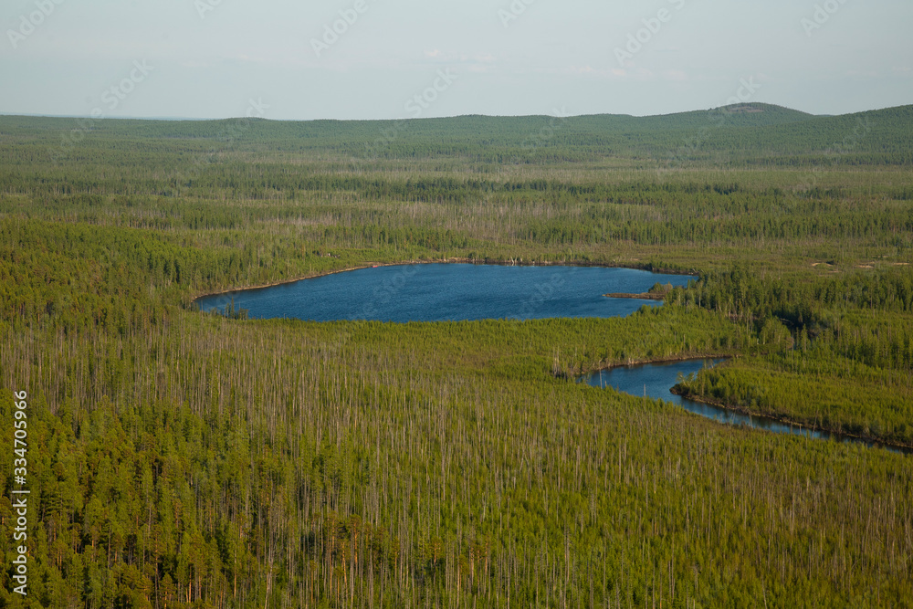 round lake in the Siberian taiga
