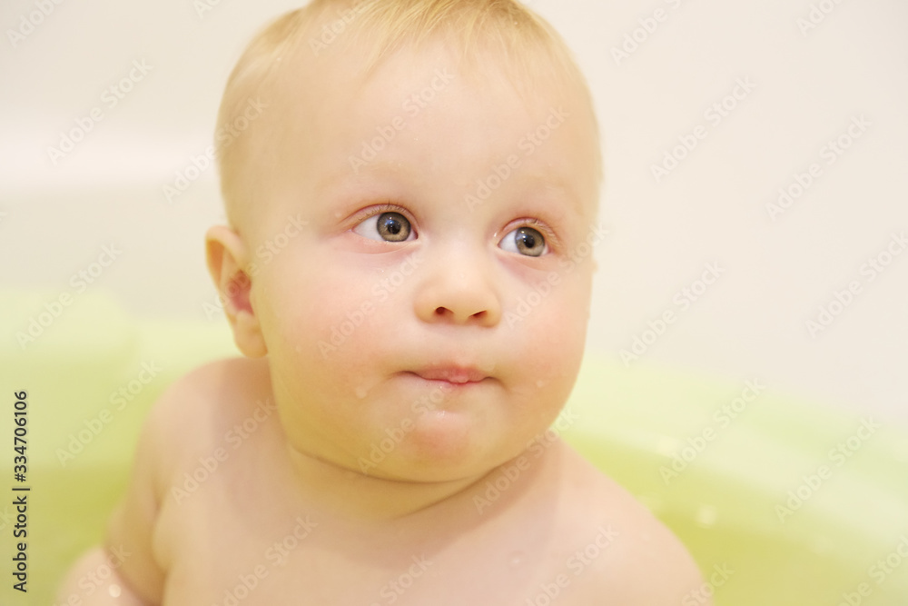 Baby girl bathing in the bathroom. The joy and happiness of bathing in the bathroom with toys is laughter positive and health. Baby girl bathing in the bathroom. The joy and happiness of bathing in the bathroom with toys is laughter positive and health.