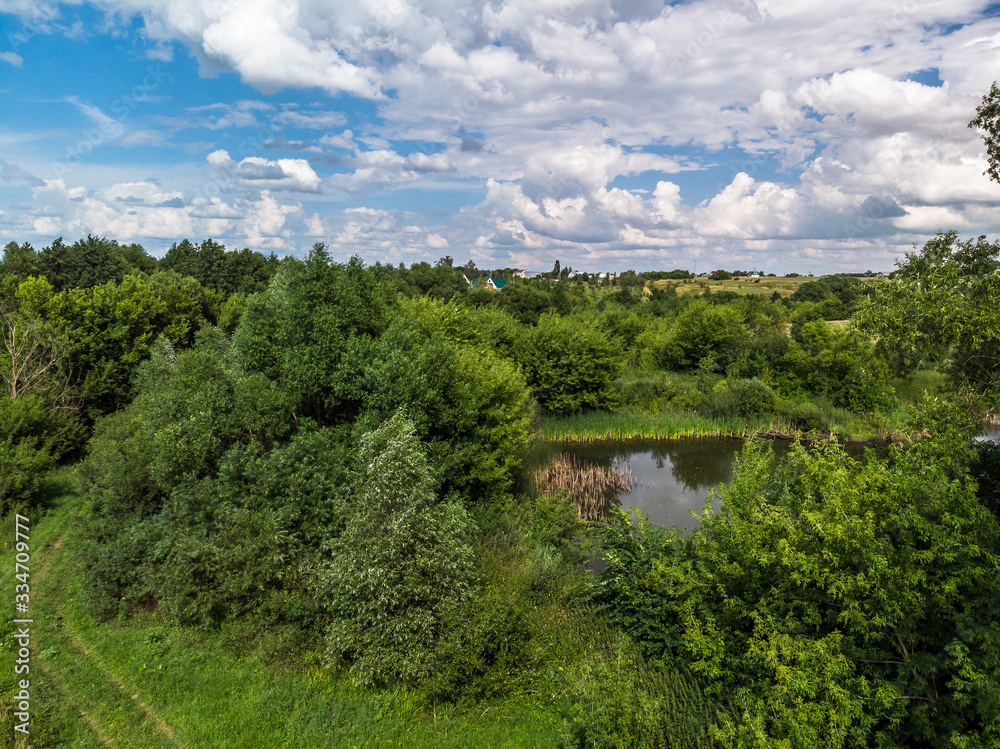 Picturesque summer countryside landscape whith pond in Russia from a height