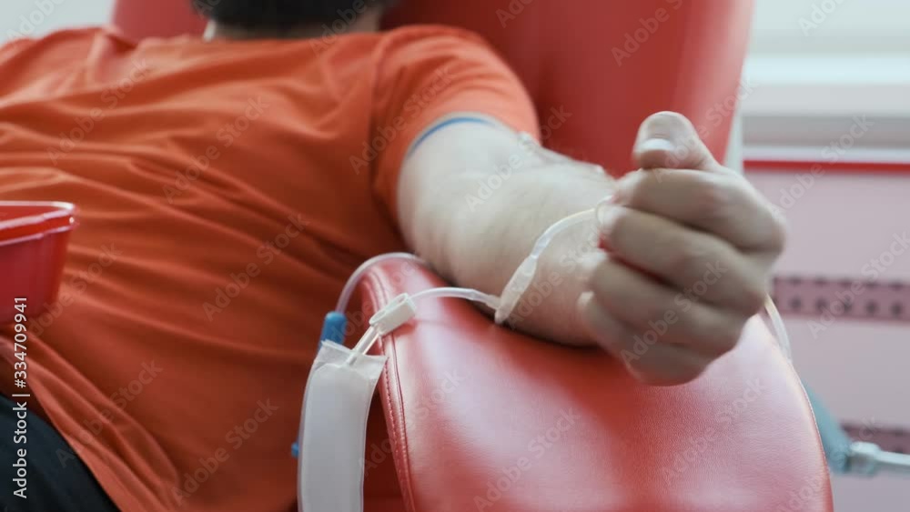Blood donor showing middle finger close up. Man shows aggressive gesture. Angry donator. Blood donation concept 4k Blood donor showing middle finger close up. Man shows aggressive gesture. Angry donator. Blood donation concept 4k