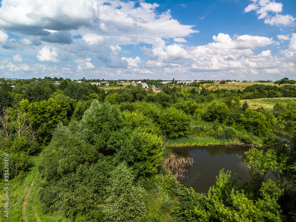 Fototapeta premium Picturesque summer countryside landscape whith pond in Russia from a height