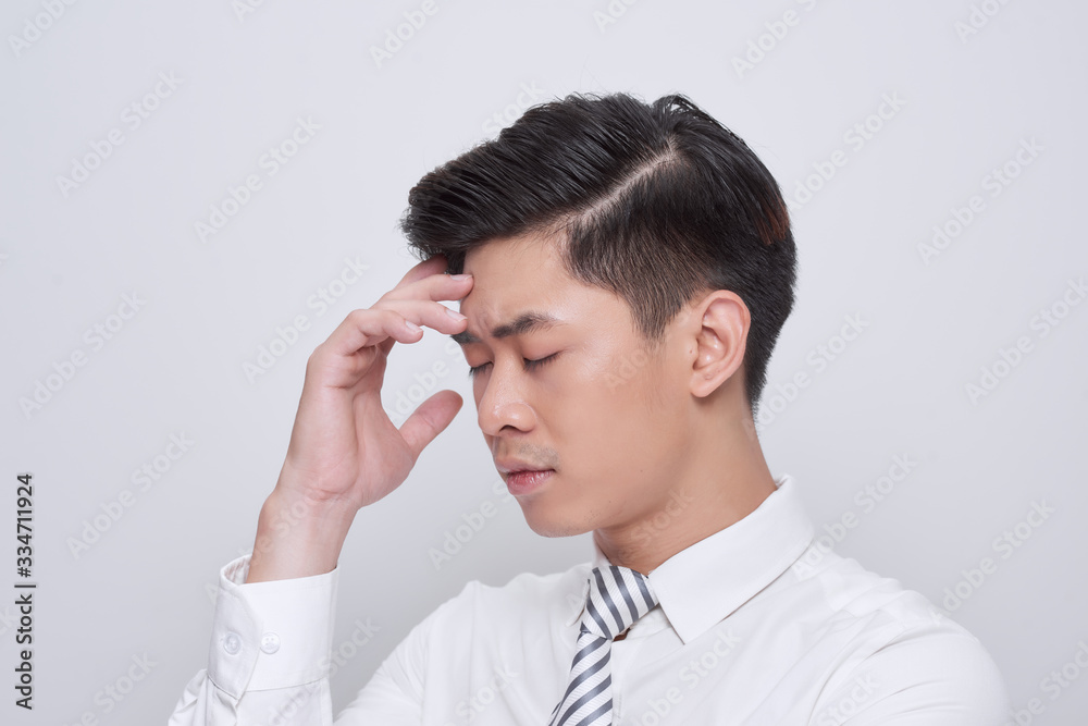 Young handsome business man wearing tie worried and stressed about a problem with hand on forehead, nervous and anxious for crisis Young handsome business man wearing tie worried and stressed about a problem with hand on forehead, nervous and anxious for crisis