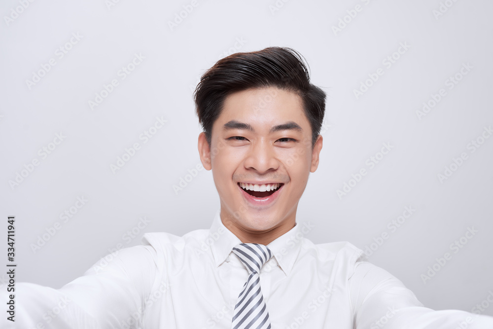 Selfie mania! Excited young guy is making selfie on a camera. Selfie mania! Excited young guy is making selfie on a camera.