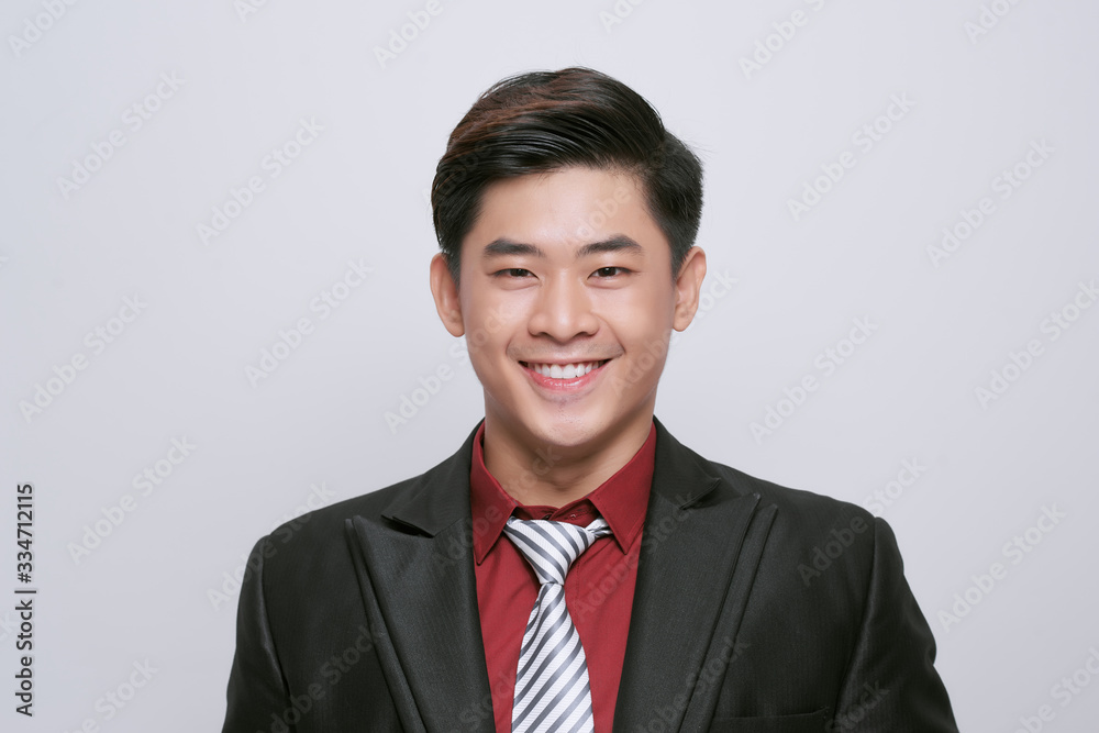 Closeup of happy smiling guy looking at camera isolated on white background Closeup of happy smiling guy looking at camera isolated on white background