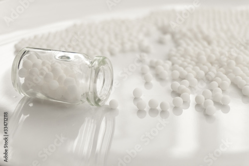 Homeopathy granules medicine isolated on a White Background photo