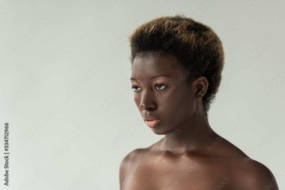 beautiful naked african american girl isolated on grey
