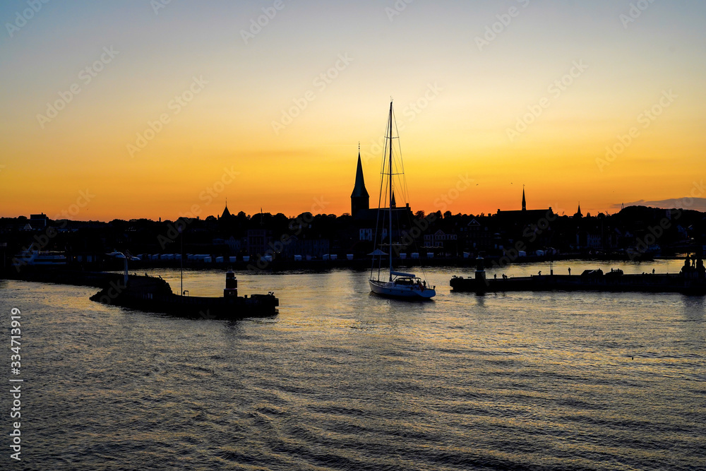 Silhouette of Helsingor harbour in sunset sky, Denmark