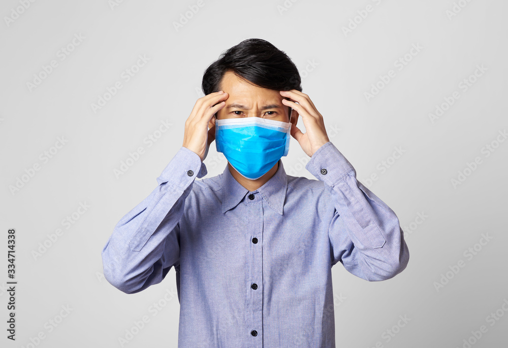 Asia man panic disorder wearing surgical mask covering mouth and nose. epidemic corona virus protection. Asia man panic disorder wearing surgical mask covering mouth and nose. epidemic corona virus protection.