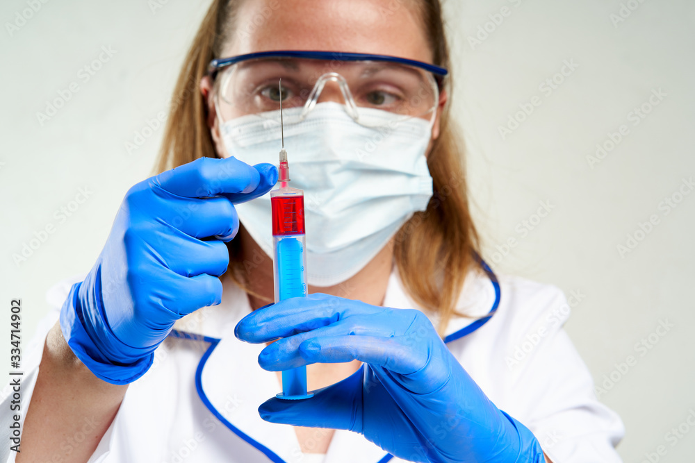 Doctor prepare a vaccination in a syringe Doctor prepare a vaccination in a syringe