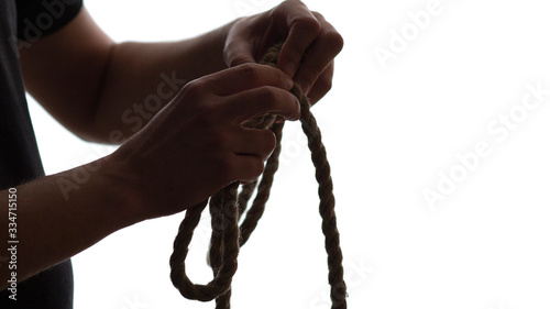 silhouette of male hands knotted noose neck noose on white isolated background, concept life failure, financial crisis
