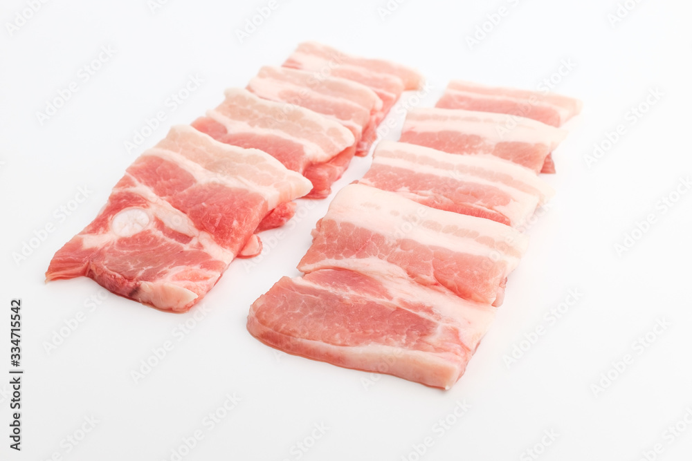 Sliced ​​pork belly on white background