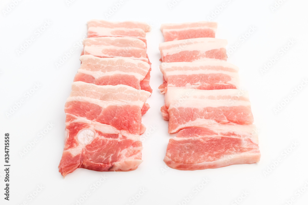 Sliced ​​pork belly on white background