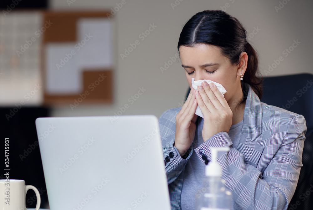 Sick, ill unhealthy female employee coughing or sneezing while working in workplace in office. Spreading and risk of corona virus covid-19 in workplace. Sick, ill unhealthy female employee coughing or sneezing while working in workplace in office. Spreading and risk of corona virus covid-19 in workplace.