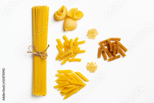 Raw italian spaghetti and pasta on a white background