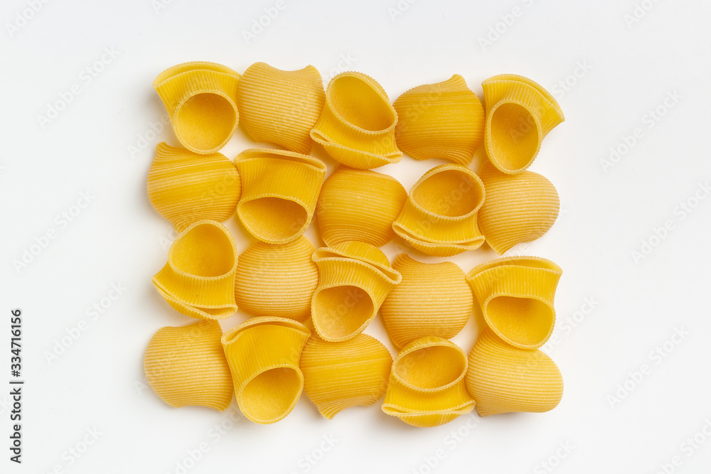 Raw italian pasta on a white background