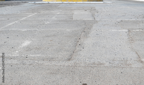 Asphalt parking next to the shopping centre, with markings in clear sunny weather during the day
