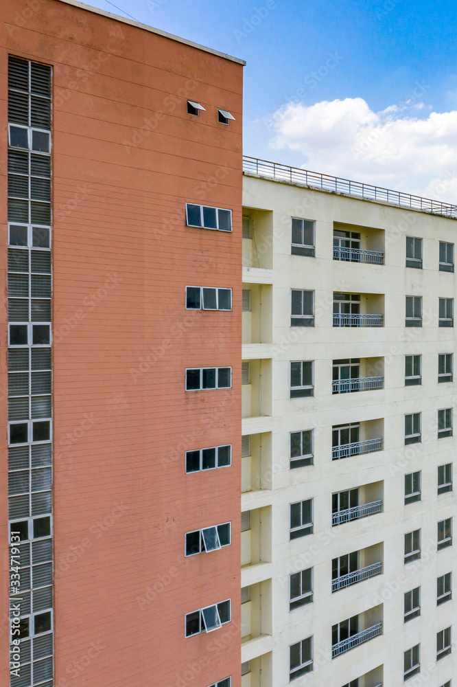 Vertical photo of apartment building with window and balcony
