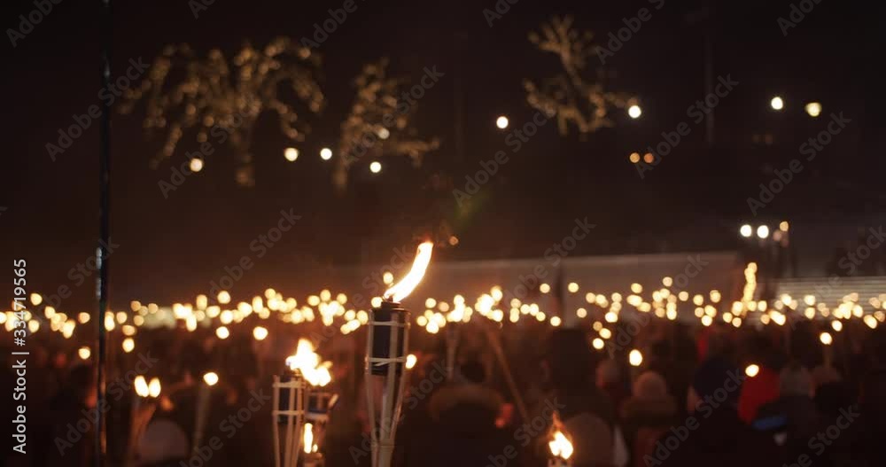 Burning torches at torchlight procession at night people protest