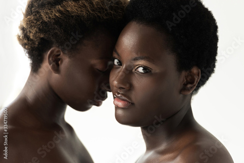 tender naked african american women hugging isolated on white