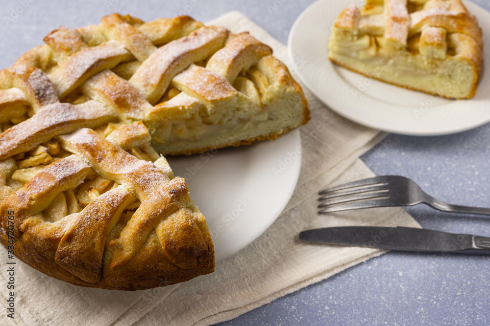 Apple pie on gray table background. Homemade classical fruit tart.