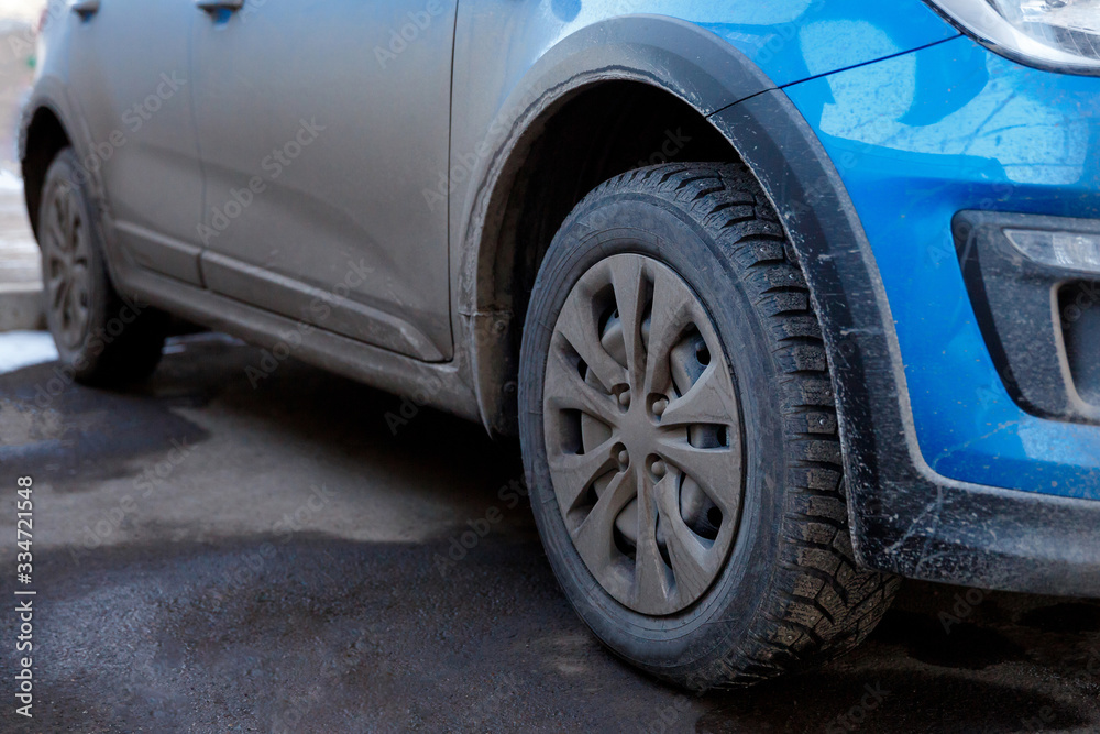 dirt and dust on the body and wheels of a car, chemistry and salt dirt and dust on the body and wheels of a car, chemistry and salt