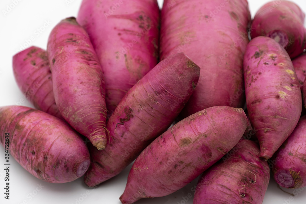 Pile of whole purple daikon radish isolated on white background Pile of whole purple daikon radish isolated on white background