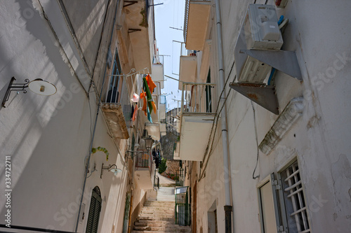View of a picturesque view of the streets of the historic center of the ancient seaside village of the city of Vieste on the Gargano in Italy.