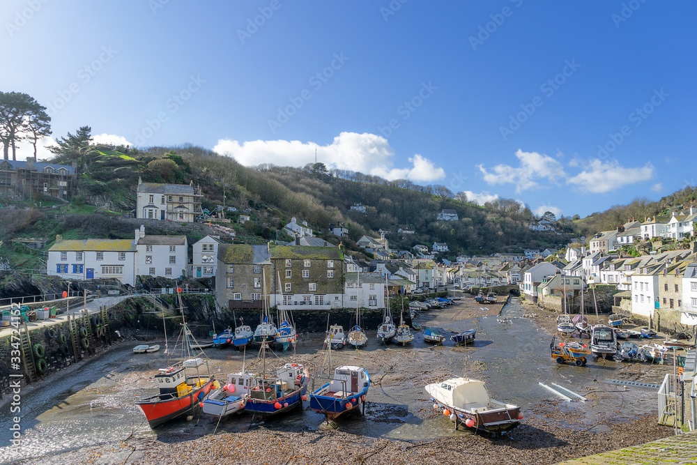 Polperro harbor at low tide in the county of Cornwall 