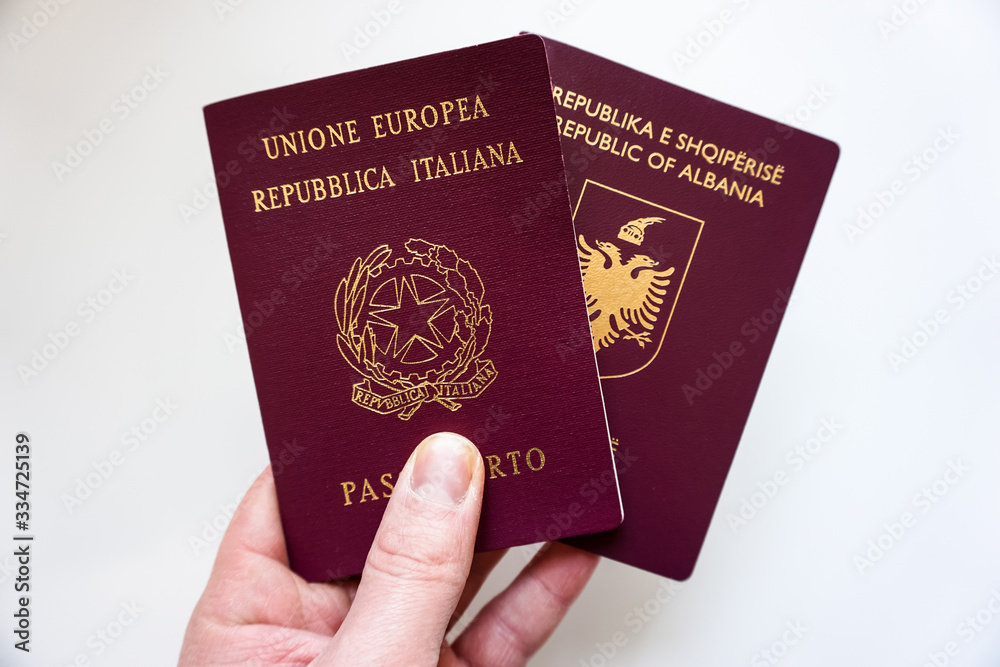 Italian and Albanian passport in white background - Different documents Italian and Albanian passport in white background - Different documents