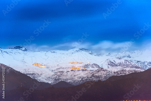 A distant view of the Ski villages over Santiago in the Andes Mountain Range photo