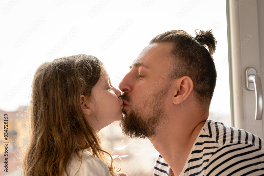 father and little daughter kissing father and little daughter kissing