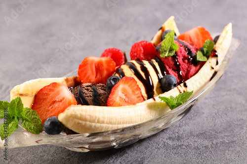 banana split- banana with icre cream and berries fruits photo